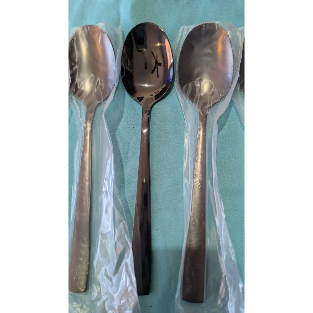 8 larger Black Spoons 7